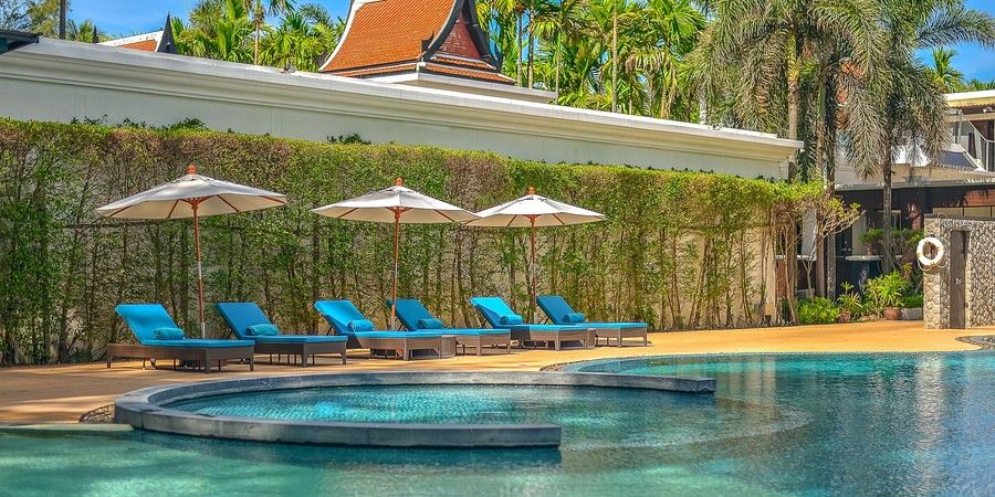 alt-text image featuring a line up of sun loungers on the poolside - Maikhao Dream Villa Resort & Spa, Phuket