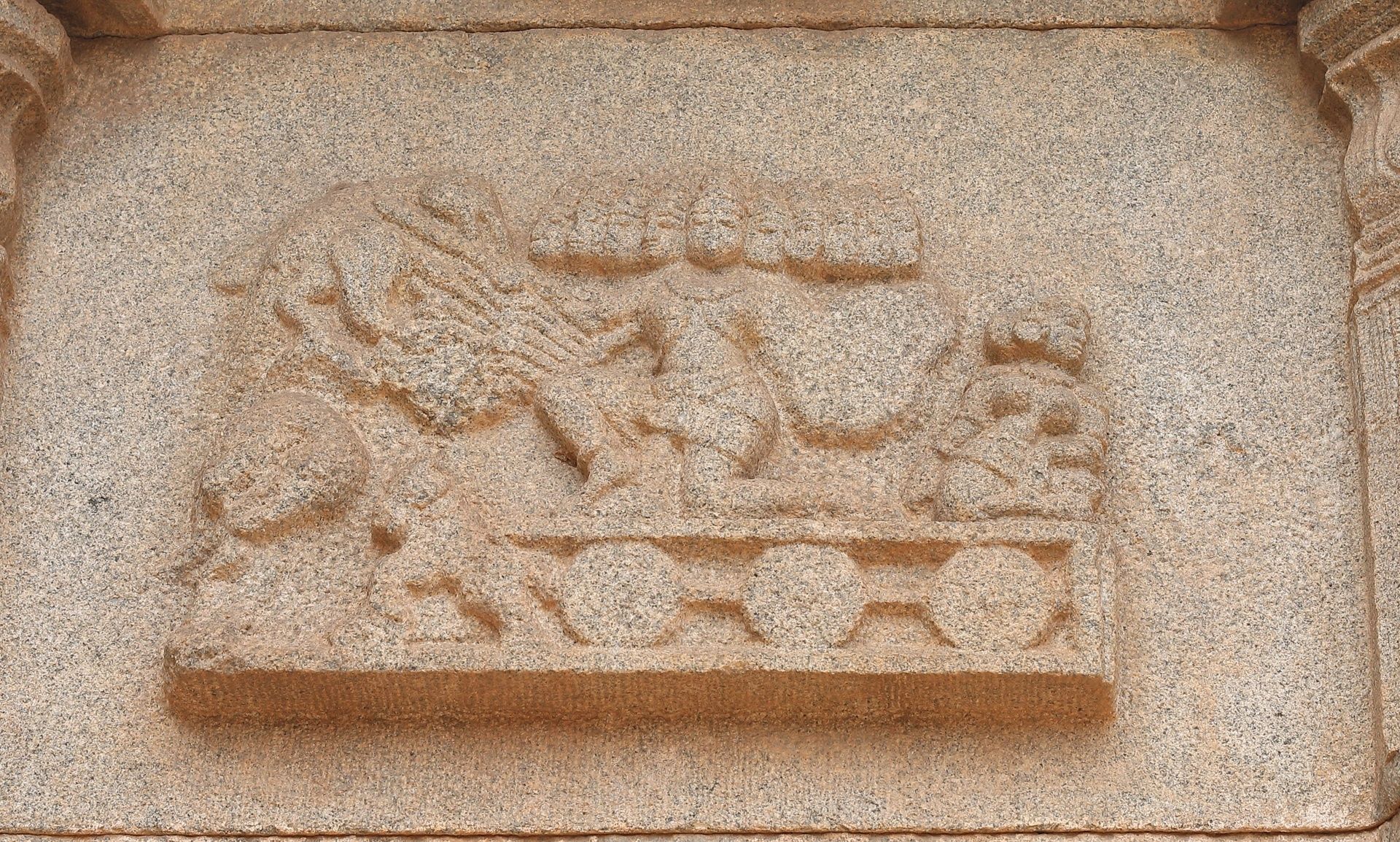 Stone bas-relief of Ravana at Hazara Rama Temple.