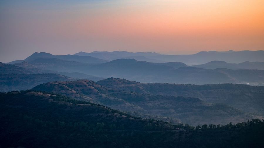 outlines of hills in western Ghats during sunset under vibrant sky