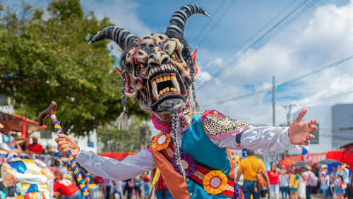 A person in colorful, festive costume.
