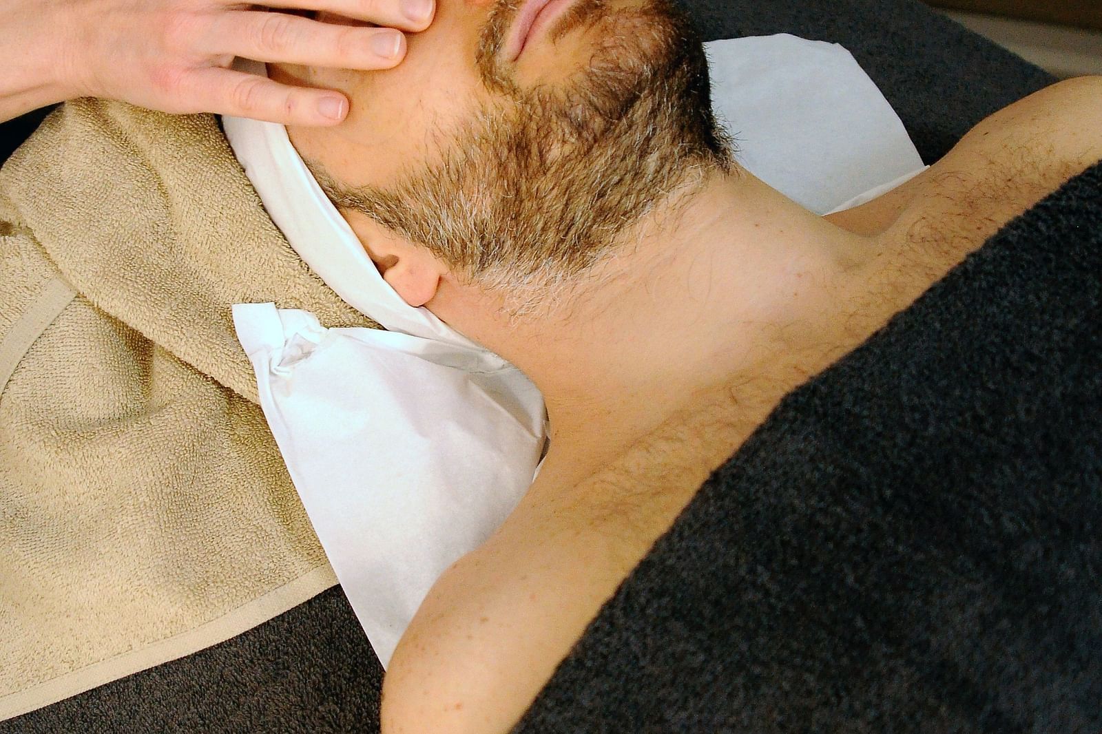 an image of a person getting a face massage - Kerala Ayurveda