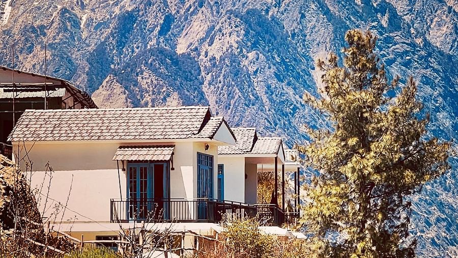 Image of the facade of Faraway Cottages, Auli and mountains in the background | Faraway Cottages, Auli