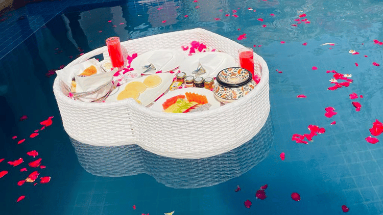 White heart-shaped floating breakfast hamper