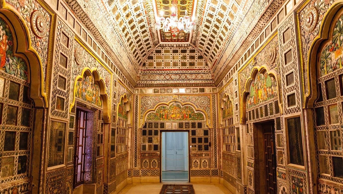 A glimpse into the grandeur of Mehrangarh Fort in Jodhpur, India, with a view of the Sheesh Mahal, a palace known for its stunning mirrorwork.