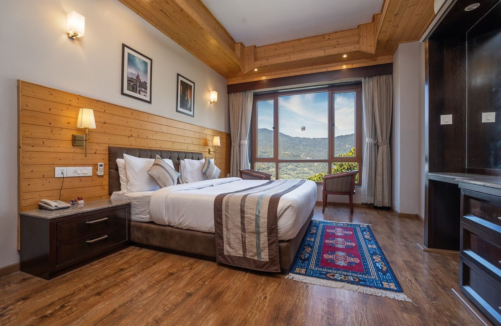 A room at Summit Alpine Abode with a double bed and mountain views