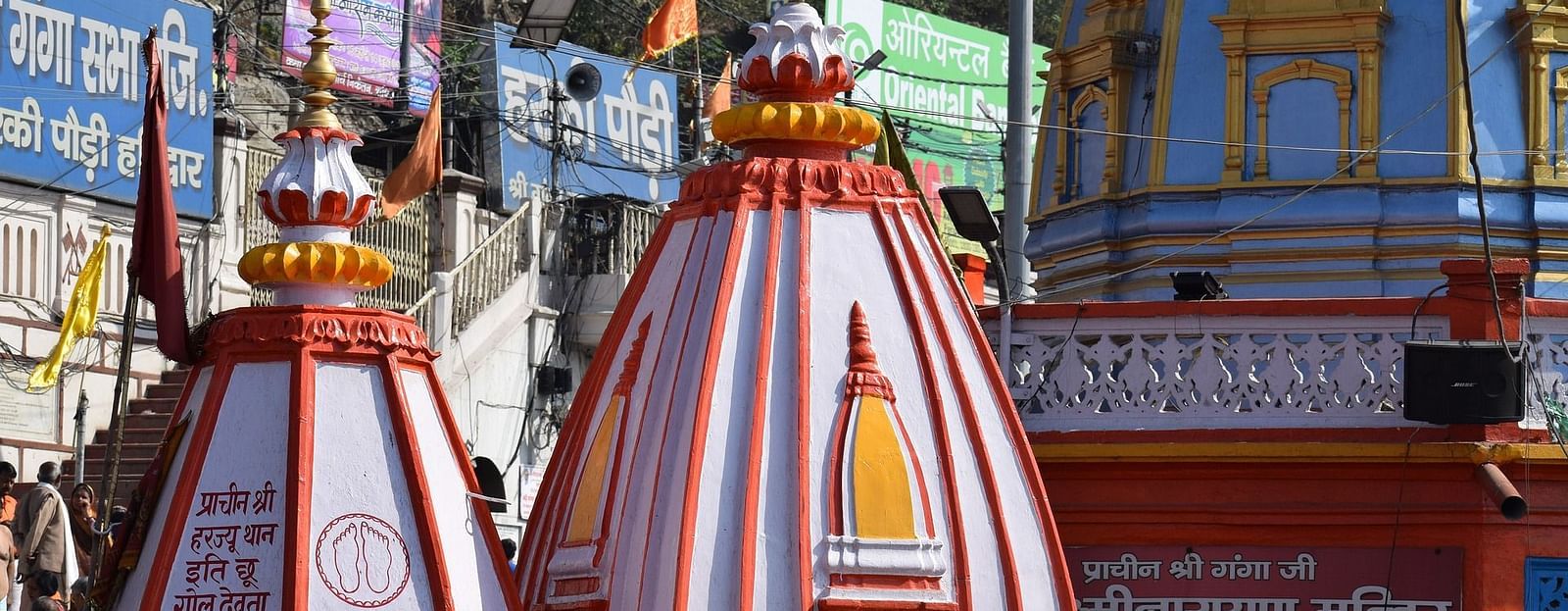 A beautiful Hindu temple complex, with intricate carvings and colorful decorations.