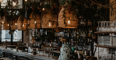 Bar counter with decorative lighting - Narrow Gauge Inn - A Serenite Hotel Near Fish Camp.
