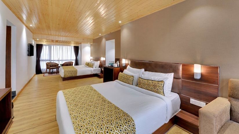 Image of a double bed in the Premium Family Room at Hotel Sumitel Vista T.V Tower 