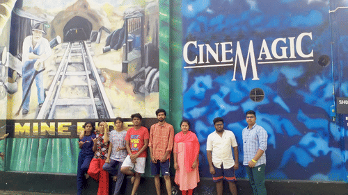 People standing in front of Cine Magic at Black thunder