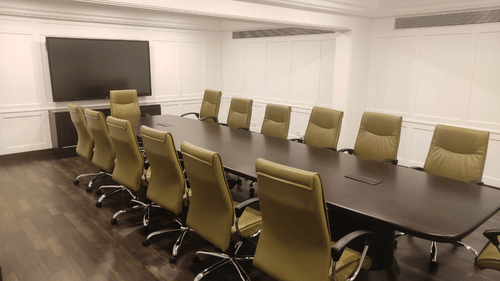 General's Boardroom at Jehan Numa Palace, featuring a modern conference room with a long table, chairs, and TV