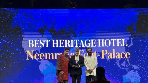 an image of three speakers standing on a stage
