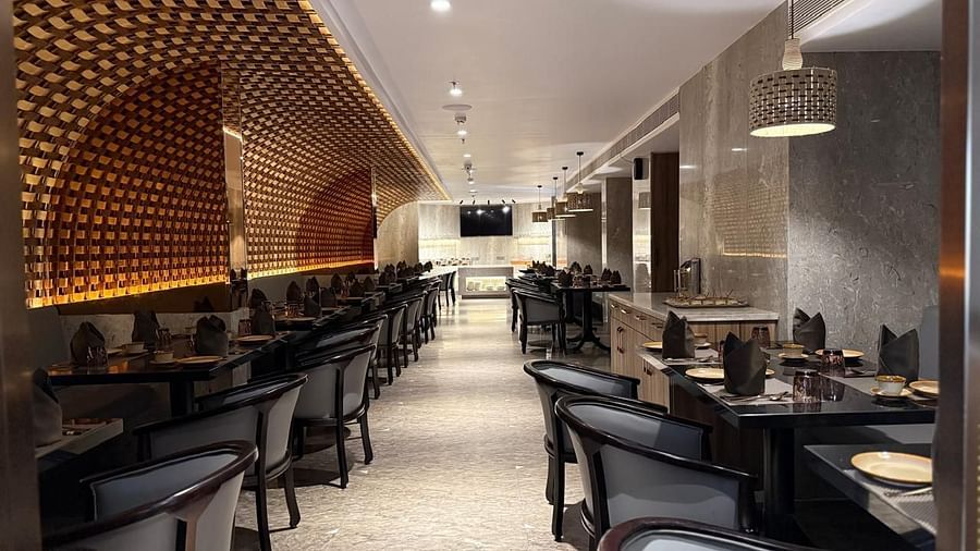 Elegant indoor dining area at Misaki restaurant, featuring modern decor, ambient lighting, and neatly arranged tables set for guests - Daspalla Executive Court, Visakhapatnam