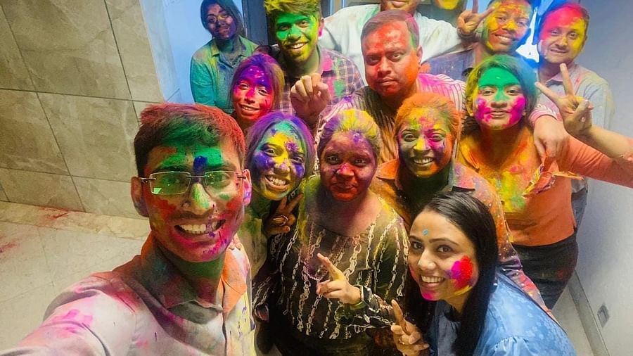 Employees of Polo towers posing during holi