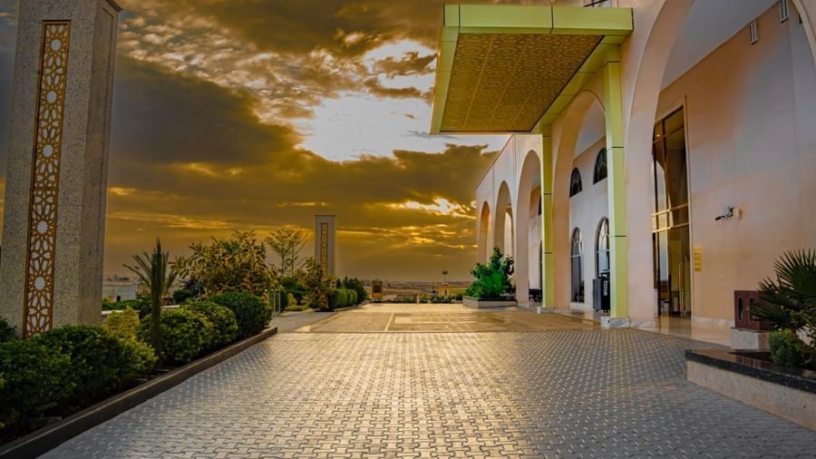 Sunset-lit walkway leading towards the hotel entrance - Serene Sarovar Premiere Hargeisa