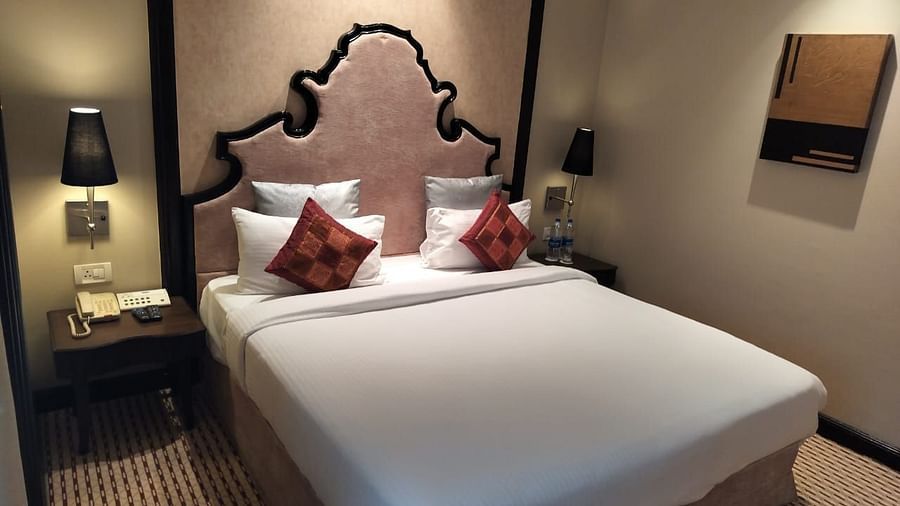  Luxurious hotel EXECUTIVE  ROOM at St Marks Hotel with bright lighting and sophisticated seating area