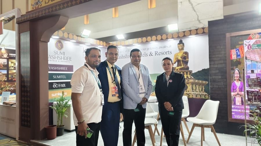 The Sumi Yashshree Hotels & Resorts team stands poised at their elegantly crafted booth, reflecting the brand's dedication to luxury, hospitality, and cultural heritage.