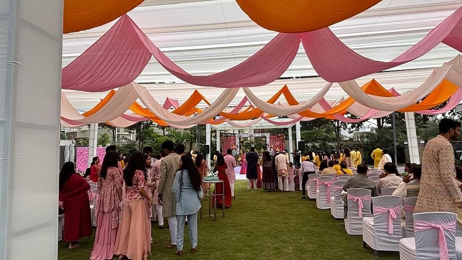 A beautifully designed canopy with drapes, hosting a lively gathering - VRR Astoria Hotel and Conventional Centre