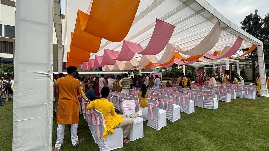 An outdoor wedding setup with vibrant drapes, neatly arranged - VRR Astoria Hotel and Conventional Centre