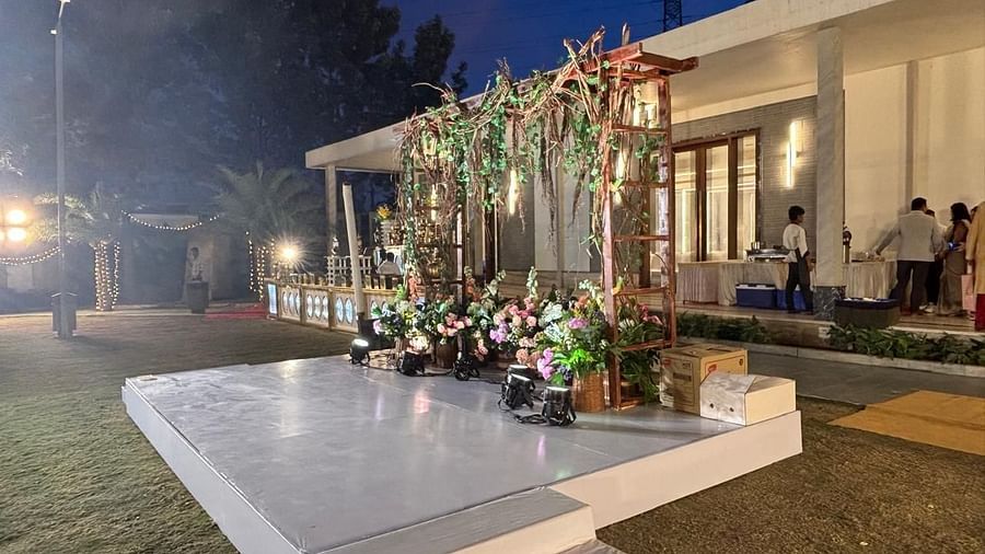 A beautifully decorated wedding venue with a floral archway.