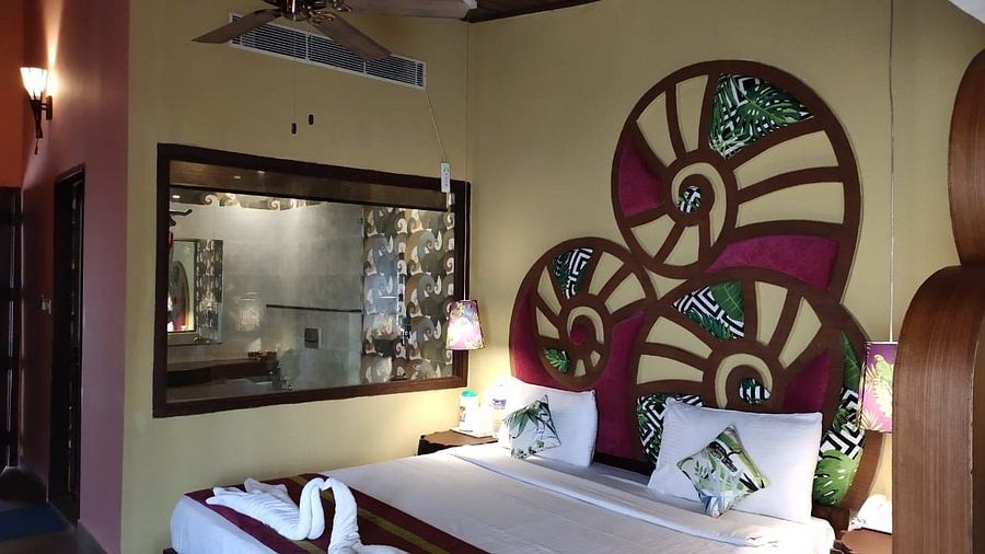 Wooden interior of Standard Rooms with a Queen size bed in Port Blair Resort 