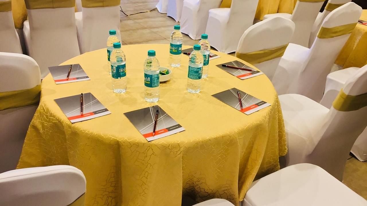 Image of a round table with chairs surrounding it at Calux Grand Baga.