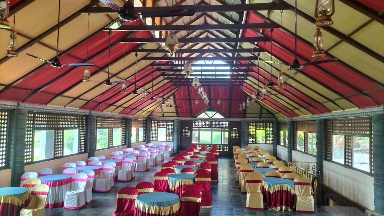 image of the Tambulam banquet hall with a vast seating area for guests - Hoysala Village Resort, Hassan.