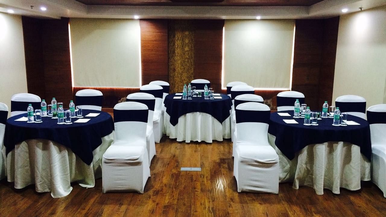 Front view shot of the Senate boardroom with wooden flooring and a false ceiling - Ramada by Wyndham, Ghaziabad, Vasundhara