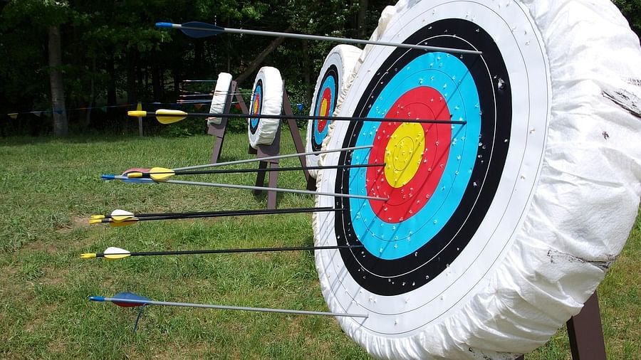 An archery range with arrows placed into target boards - Aalia Jungle Resort & Spa