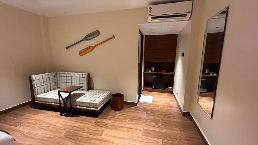 Cosy seating area with wooden flooring and stylish décor in a guest room- Arina Island Resort, Swaraj Dweep