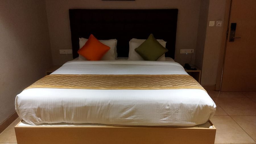 view of king size bed of Family Room at Cholaa Dynasty, Kumbakonam