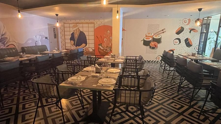 Spacious dining area with contemporary decor and vibrant murals at Hotel Kyzen HiTech City – Your Zenly Stay