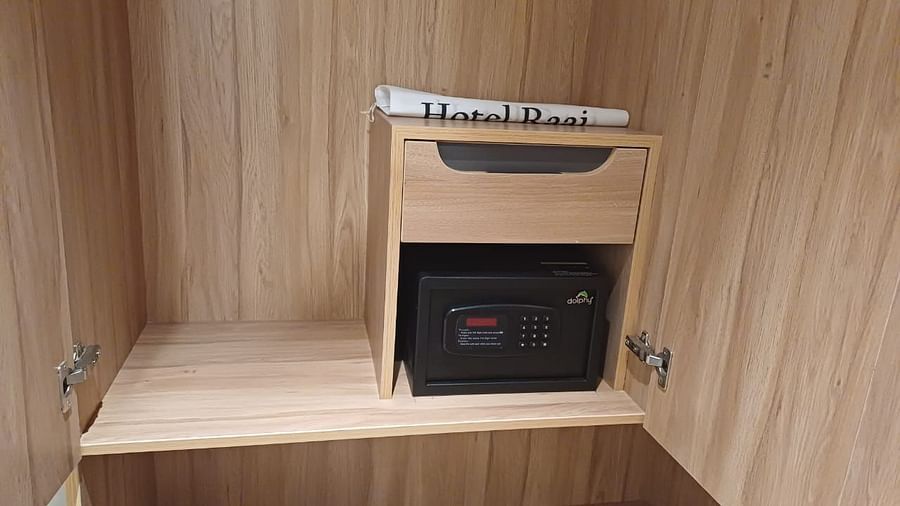 Image of a wardrobe with safe locker at Hotel Raai, Hosur.