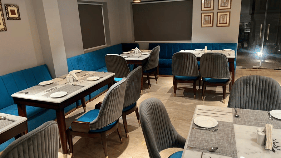 Spacious dining area with comfortable seating, modern interiors and a relaxed setting at Hotel Southgate Goa, Calangute, ideal for enjoying meals with family.
