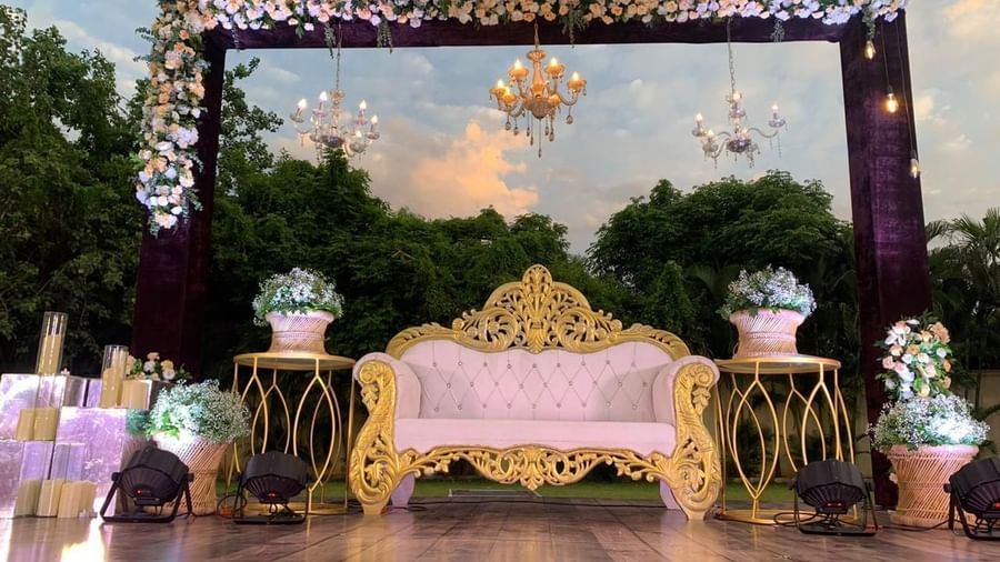Stylish evening stage arrangement with intricate floral decor at Ilara Hotels & Spa, OMR, Chennai