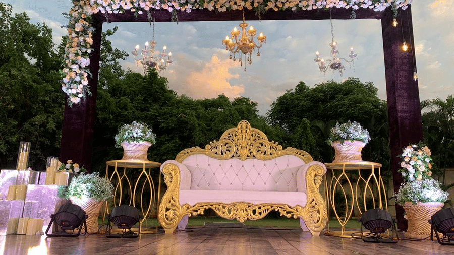 Stylish evening stage arrangement with intricate floral decor at Ilara Hotels & Spa, OMR, Chennai