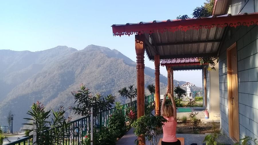 balcony seats under a conopy with mountain views - neer ganga resorts