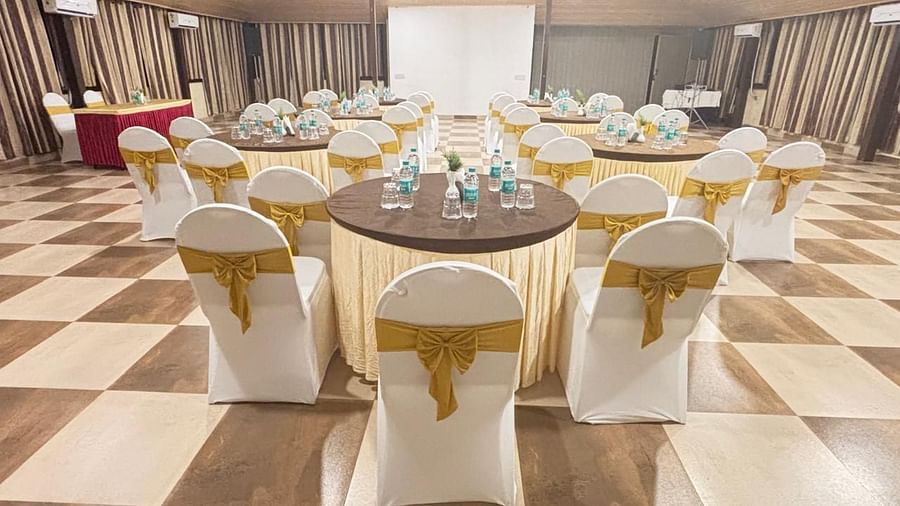 Another angle of the banquet hall, focusing on the seating arrangement and overall space | Ballroom | Woodstock Resorts, Coorg