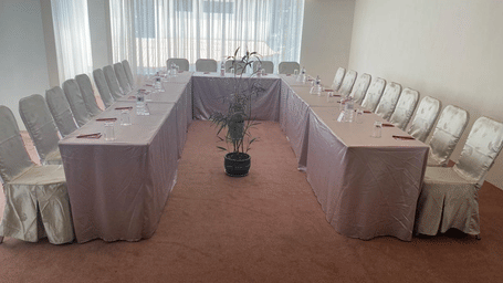 A banquet hall, windows with curtains 