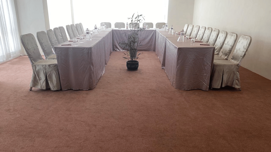 A banquet hall, windows with curtains