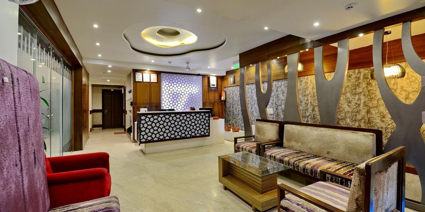 Reception and lobby area with ambient lighting at Hotel Emerald, Chandigarh