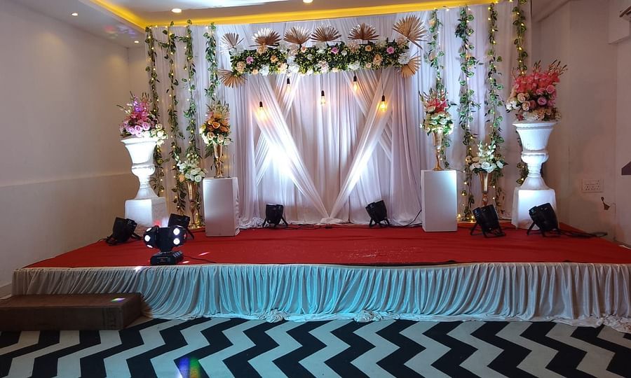 Image of  a pulpit with flower and plant decorations at Vagator Downtown, Goa