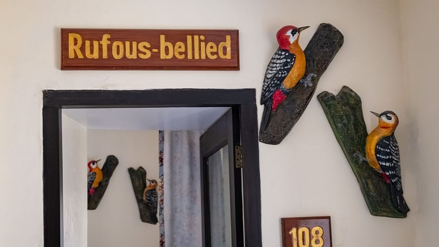 Two bird figurines on the wall at the hotel entrance at The Pavilion, Nainital