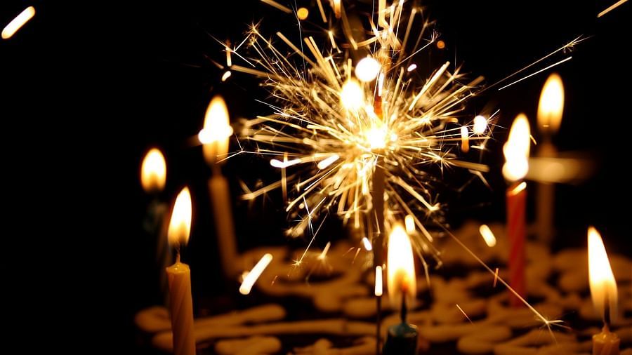 candles being lit with a sparkler in the centre