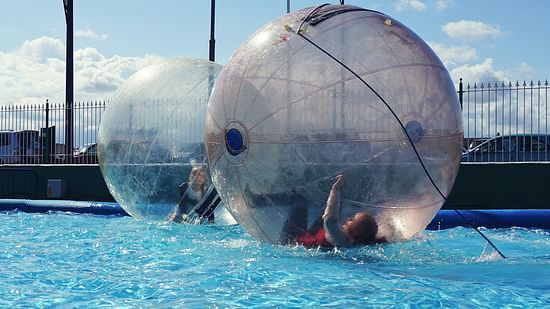 kids playing pool zorbing - Mastiff Grand La Villae Resort, Lonavala
