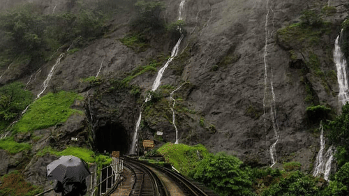a waterfall cascading down a hill 4