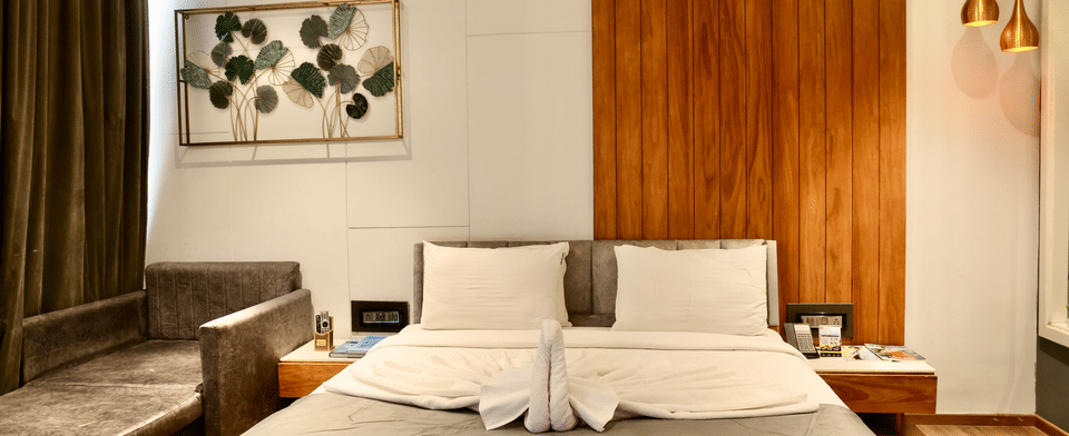 Premier Room, Bed with day bed and framed botanical art
