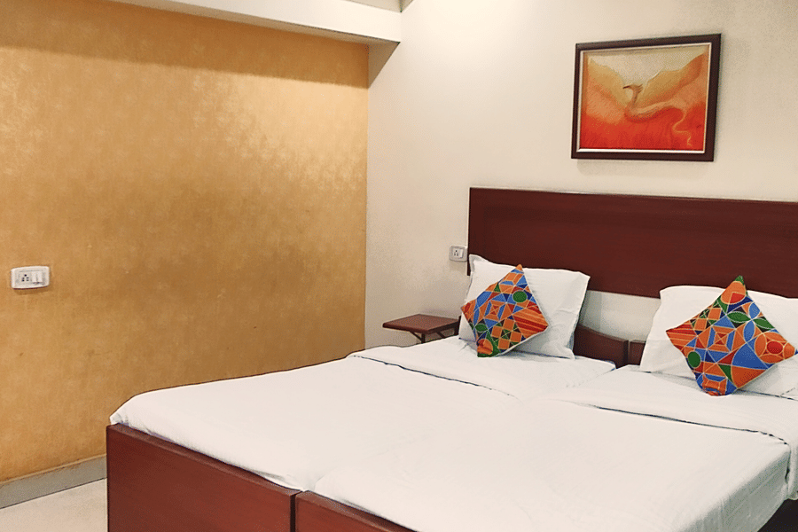 Spacious Executive Room at Udipi Home with double bed and modern decor