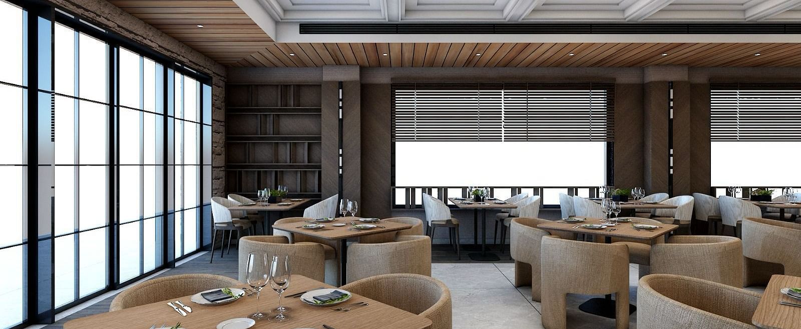 Dining tables placed besides the huge windows emitting plenty of natural light from outside - Namaste Corbett 