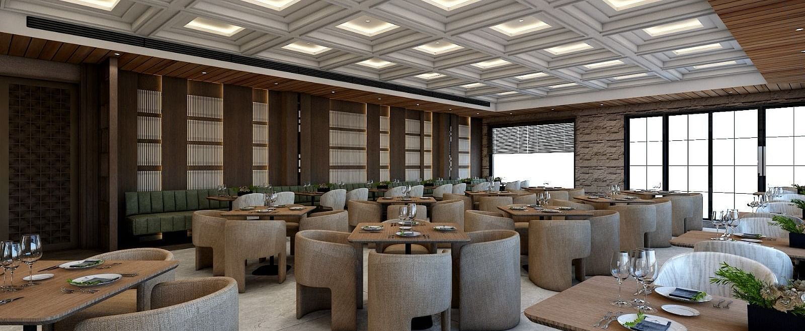 Corner view image of the restaurant with well arranged seating area and a false ceiling above it - Namaste Corbett