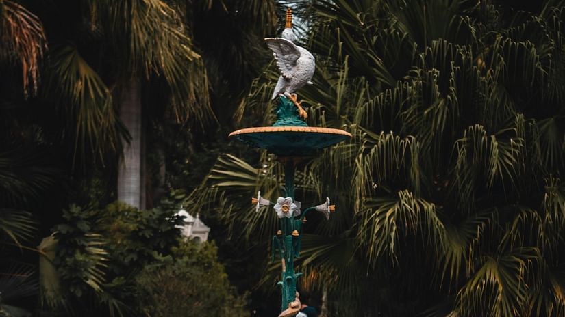 A fountain with bird statues on it inside Saheliyon Ki Bari in Udaipur